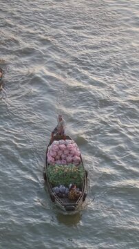 Aerial view of Cai Rang floating market. CaiRang is famous market in mekong delta, Can Tho, Vietnam. Tourists, people buy and sell food, vegetable, fruits on boat, ship. The vibrant scene, crowded
