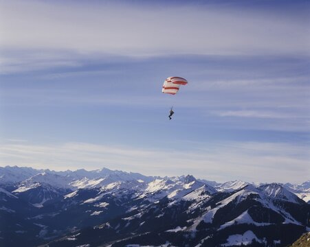 Paraglider over the Alps view from mountain Hohe Salve to the south Tyrol Austria