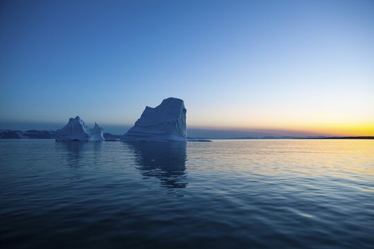 Icebergs at sunset, midnight sun, Scoresbysund, East Greenland, Greenland