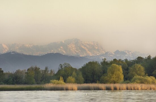View of the south end of the Ammer lake and of the Alps with Wettersteinmassiv und Zugspitze from restaurant Aidenried Fischen Paehl Landkreis Weilheim in upper Bavaria Germany