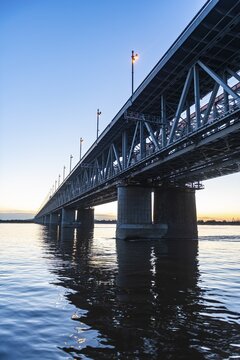Giant bridge spanning over the Amur river at sunset, Khabarovsk, Khabarovsk Krai, Russia