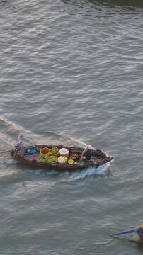 Aerial view of Cai Rang floating market. CaiRang is famous market in mekong delta, Can Tho, Vietnam. Tourists, people buy and sell food, vegetable, fruits on boat, ship. The vibrant scene, crowded
