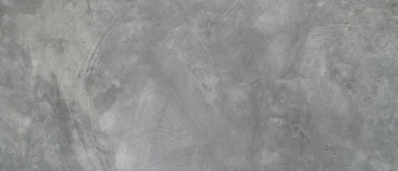 Rough gray textured cement wall surface suitable for industrial designs, mottled unfinished pattern stone background for a raw aesthetic. © Dinamartina93