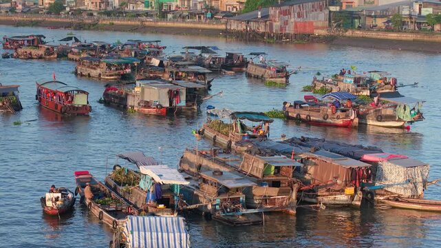 Aerial view of Cai Rang floating market. CaiRang is famous market in mekong delta, Can Tho, Vietnam. Tourists, people buy and sell food, vegetable, fruits on boat, ship. The vibrant scene, crowded