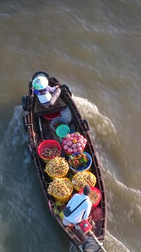 Aerial view of Cai Rang floating market. CaiRang is famous market in mekong delta, Can Tho, Vietnam. Tourists, people buy and sell food, vegetable, fruits on boat, ship. The vibrant scene, crowded