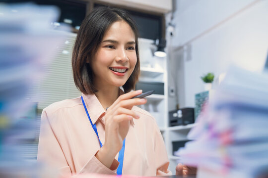 Young Asian businesswoman working on laptop in office, professional corporate employee and digital business concept.