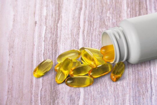 Plastic bottle on a with pills, healthy diet concept