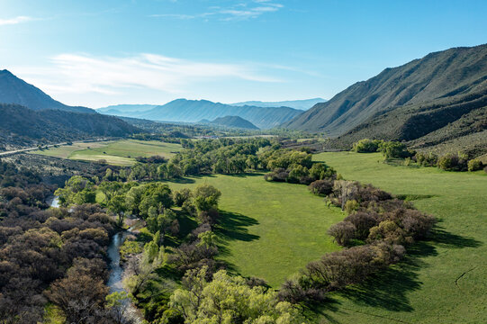 Aerial view of Grass Valley in Garfield County, Colorado on early spring morning under sunny diffuse cloudscape.