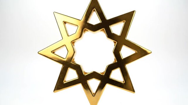 Golden nine pointed star isolated on white studio background