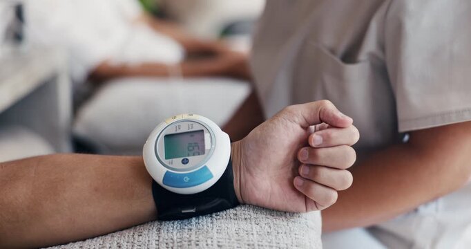 Blood pressure monitor, hand or people in clinic with check, screening or safety guide in vital exam. Digital, results or practitioner in center with tech, hydration or pulse track in drip lounge
