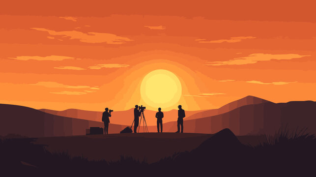 Silhouettes of camera crew filming at sunset with mountainous background