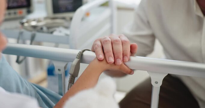 Comfort, holding hands and man with child in hospital for healthcare, empathy and console for wellness. Support, medical care or father with sick girl for assurance, compassion and pediatric patient