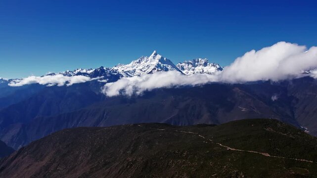 Snow Covered Himalayan Mountains Above Clouds Under Blue Sky in Himalayas