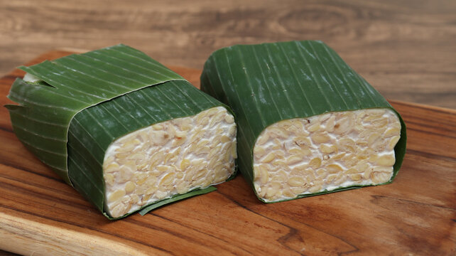 Raw Tempeh or Tempe on wooden background