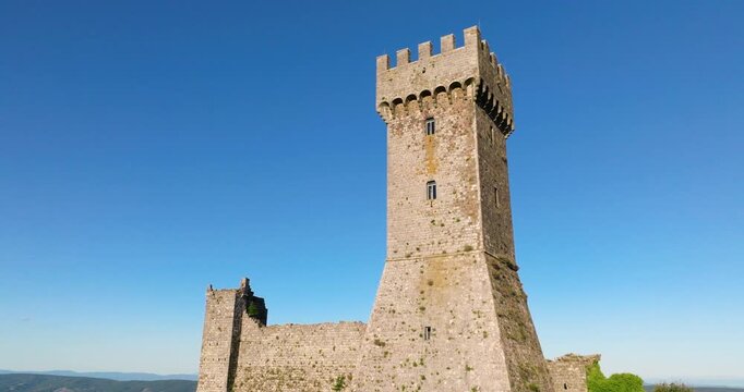 Radicofani Fortress Against Blue Sky In Tuscany, Italy - Drone Shot