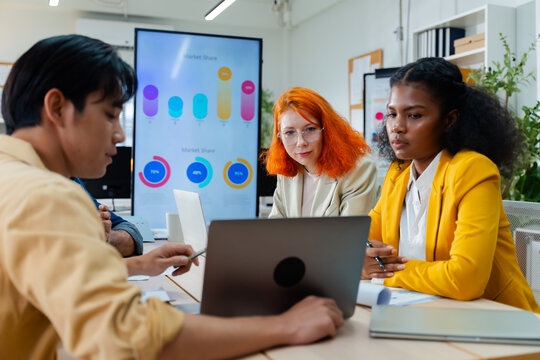 Group of young creative multiethnic business team brain storm meeting presentation,discussing roadmap to product launch, planning,strategy,new business development,working with new startup project