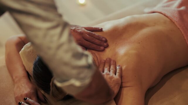 Masseur Doing Back Massage For Client. Massaging Shoulder Spine For Relaxation Wellbeing Treatment. Body Healthcare 