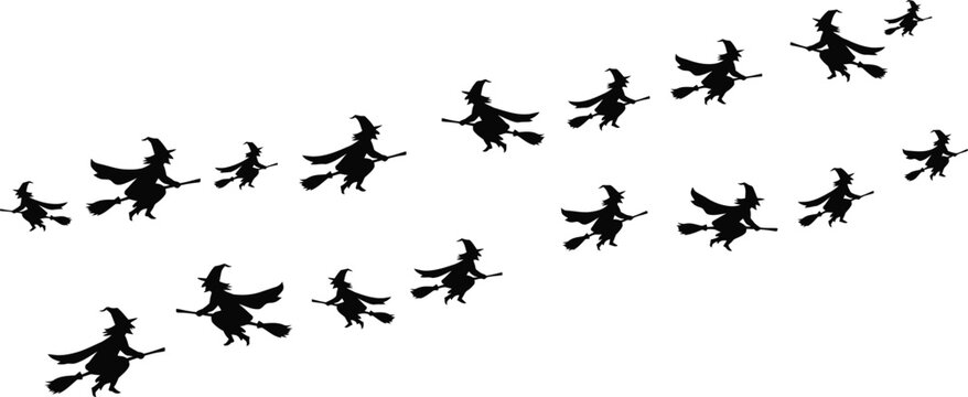 Halloween witch silhouettes flying on broomsticks