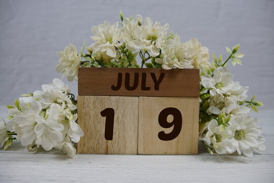 Wooden Calendar Showing the Date of July 19th. Day 19 of July month