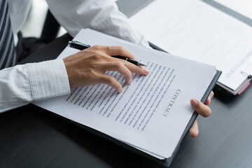 Fototapeta premium Lawyer reading legal document in office room