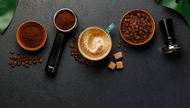 Espresso preparation tools and coffee beans flat lay composition