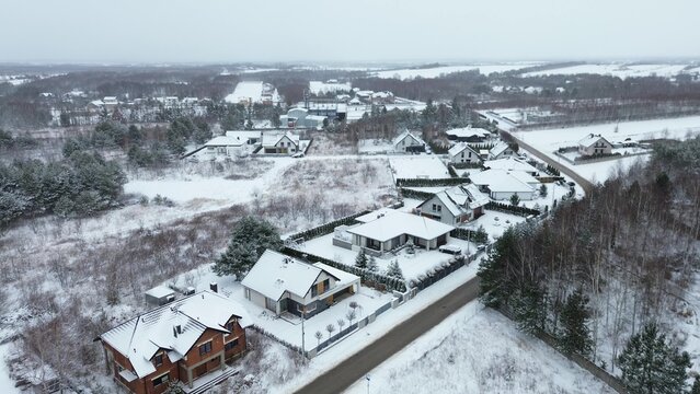Frozen village with houses and snowy rooftops