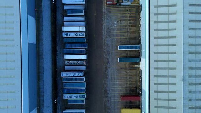 Drone view of a large HGV fleet lined up at a distribution center in Northamptonshire.