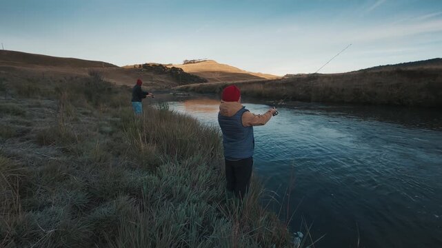 Man fishing in the river on the south of Brazil and casts the lure