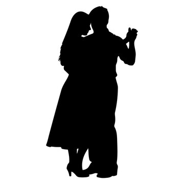 Silhouette of a couple dancing romantically.