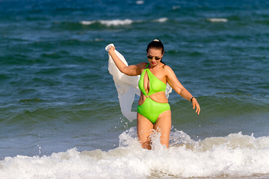 Woman big body in green swimsuit relax