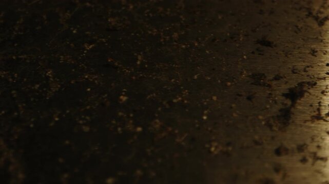 Beautiful macro dolly of dirt and rust on a metal and rusty saw at an occult altar, bloody ropes are revealed at the end of the shot