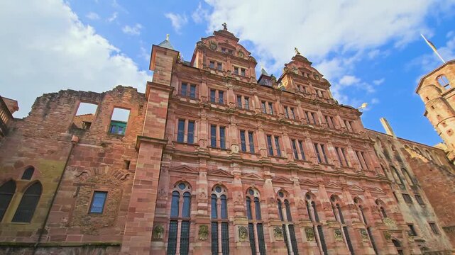 Low-angle view of the Friedrich Building at Heidelberg Castle in Heidelberg, Germany, featuring richly decorated Renaissance architecture, palace ruins and vivid historic detail throughout.