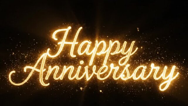 A glowing golden text that says Happy Anniversary with sparkling particles on a dark background.