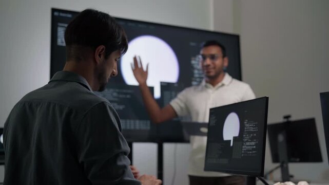 Adult indian engineer programmer presentation coding AI artificial intelligence algorithm coder training monitor developer expertise programming IT technology career