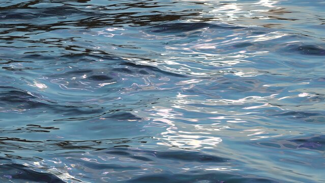 Abstract wallpaper of calm water with an oil-slick opalescent sheen, subtle ripples, pearl and lavender iridescent highlights