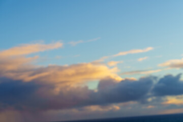 Naklejka premium Blues sky pink cloud ethereal background over land in silhouette.