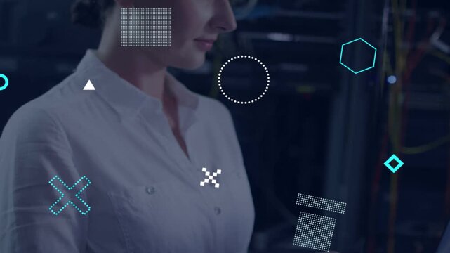 IT tech typing laptop starting teal shapes hiding then showing racks cam pulling back checking net