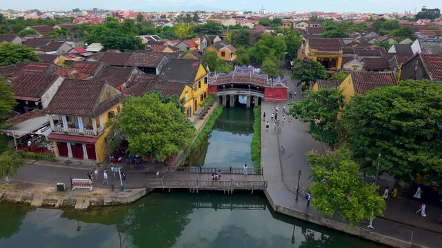 Aerial view of Chua Cau or Japanese Covered ancient Bridge and River in Old city of Hoi An, Vietnam. One of the most travel popular touristic destinations, UNESCO world heritage 