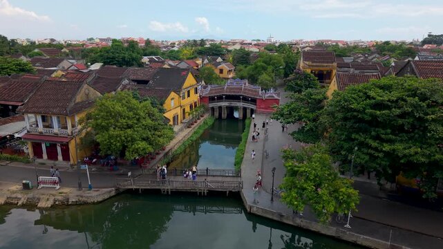 Aerial view of Chua Cau or Japanese Covered ancient Bridge and River in Old city of Hoi An, Vietnam. One of the most travel popular touristic destinations, UNESCO world heritage 