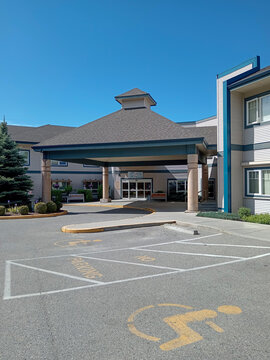 Penticton, Canada - May 22, 2026: The handicap parking area outside Haven Hill retirement home in Penticton, Canada. The entrance is covered and accessible.