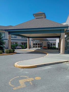 Penticton, Canada - May 22, 2026: The handicap parking area outside Haven Hill retirement home in Penticton, Canada. The entrance is covered and accessible.