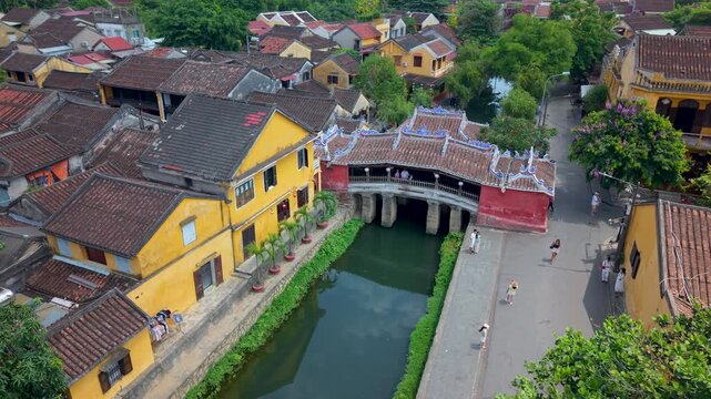 Aerial view of Chua Cau or Japanese Covered ancient Bridge and River in Old city of Hoi An, Vietnam. One of the most travel popular touristic destinations, UNESCO world heritage 