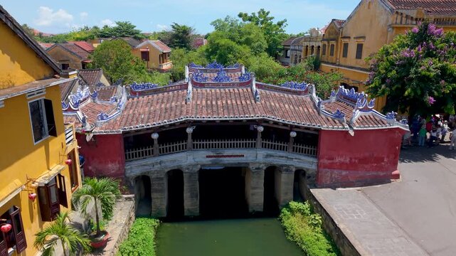 Aerial view of Chua Cau or Japanese Covered ancient Bridge and River in Old city of Hoi An, Vietnam. One of the most travel popular touristic destinations, UNESCO world heritage 