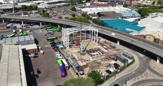 Leeds, UK, 22nd May 2026: Aerial drone view of a new commercial building under construction beside the Leeds Inner Ring Road in Leeds West Yorkshire UK showing steel framework and urban infrastructure