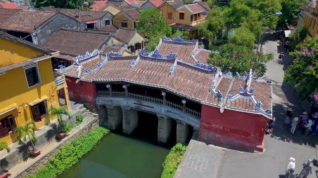Aerial view of Chua Cau or Japanese Covered ancient Bridge and River in Old city of Hoi An, Vietnam. One of the most travel popular touristic destinations, UNESCO world heritage 