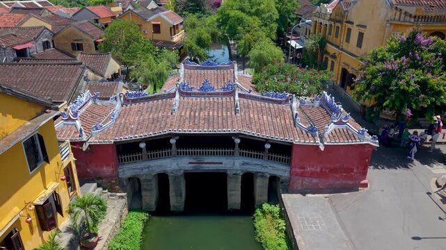 Aerial view of Chua Cau or Japanese Covered ancient Bridge and River in Old city of Hoi An, Vietnam. One of the most travel popular touristic destinations, UNESCO world heritage 