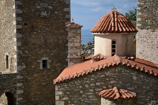 Landscape with scenic view of  Aghios Spyridon a traditional stone built Greek Orthodox church in the historic village of Vatheia in Mani, Greece