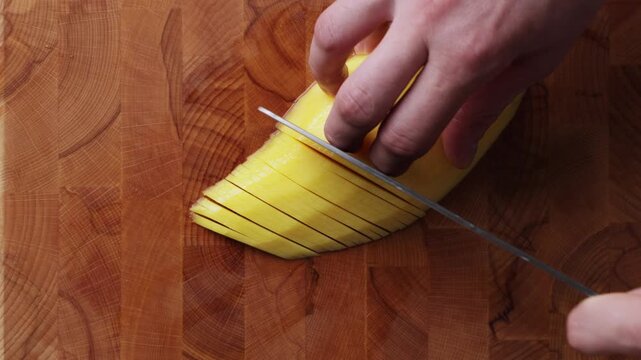 Slicing Fresh Mango Into Thin Slices Top View Close Up

