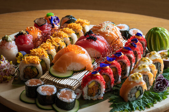 Variety of Sushi with Decorative Garnishes. Assorted Sushi Platter with Colorful Toppings