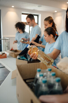 Volunteers sorting donations for food and clothing charity